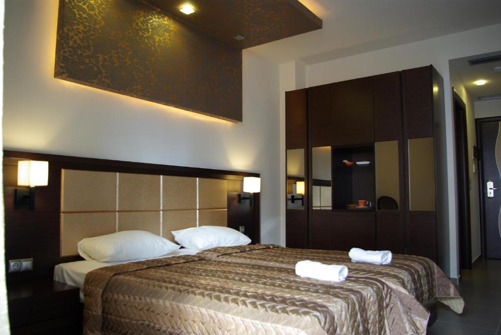 Postel nebo postele na pokoji v ubytování Dion Hotel