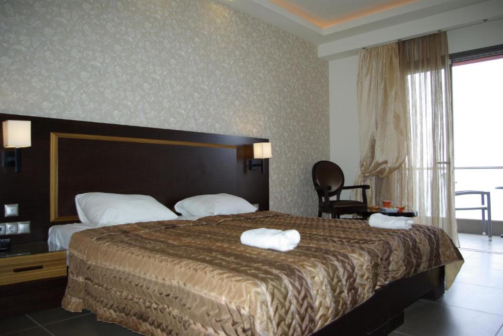 Postel nebo postele na pokoji v ubytování Dion Hotel