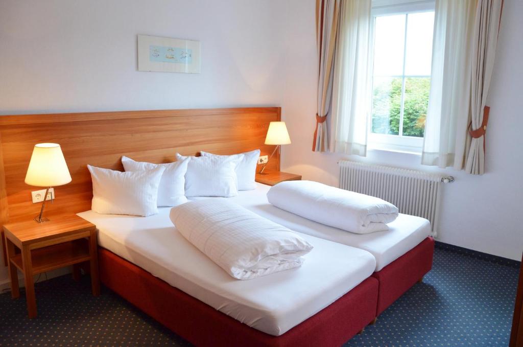 Postel nebo postele na pokoji v ubytování Seehotel Schlick