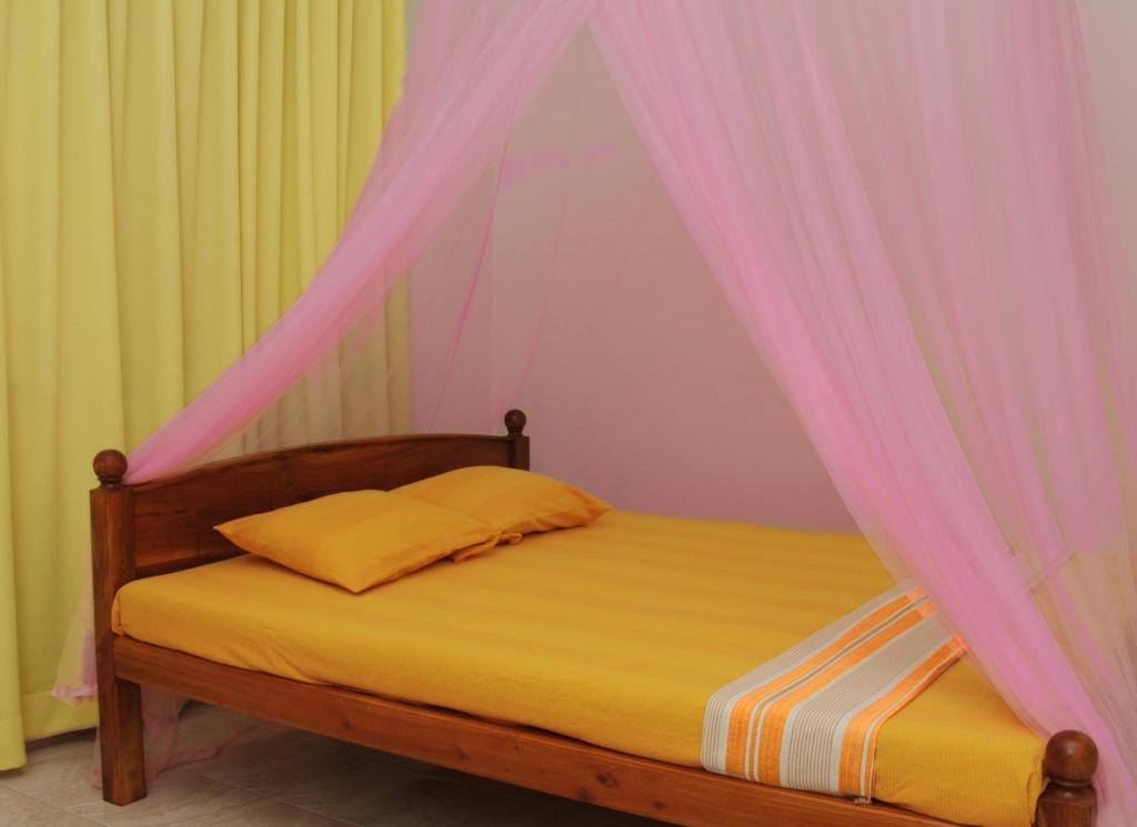 Postel nebo postele na pokoji v ubytování Tissa Resort