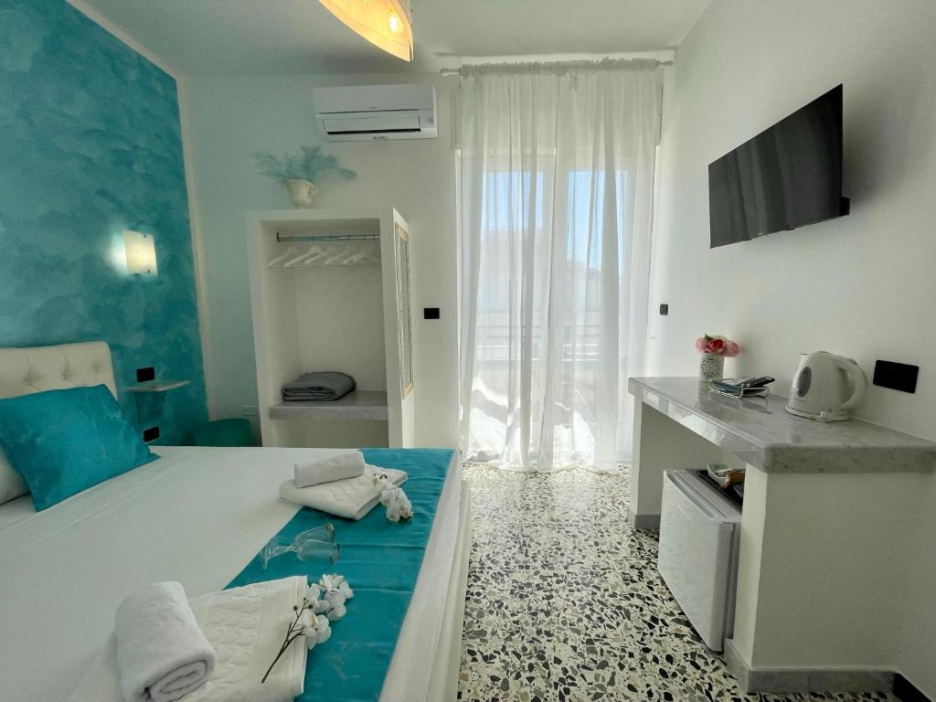 Posteľ alebo postele v izbe v ubytovaní B&B Poesia