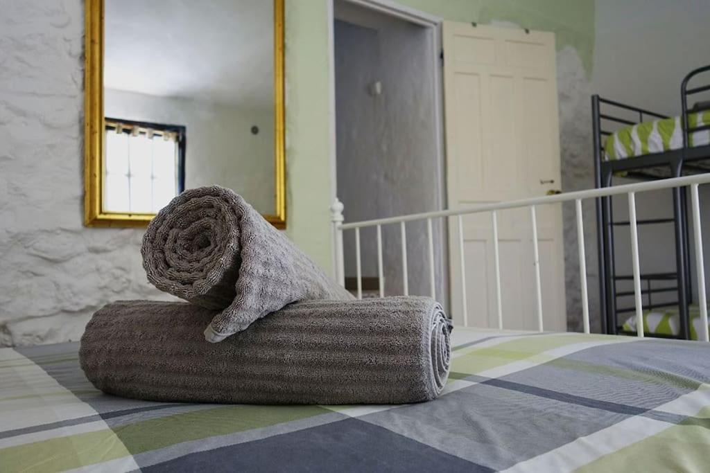 Postel nebo postele na pokoji v ubytování Olive Branch El Chorro