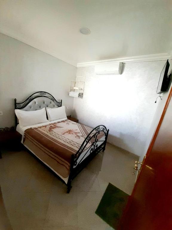 Postel nebo postele na pokoji v ubytování Hotel salem leksor