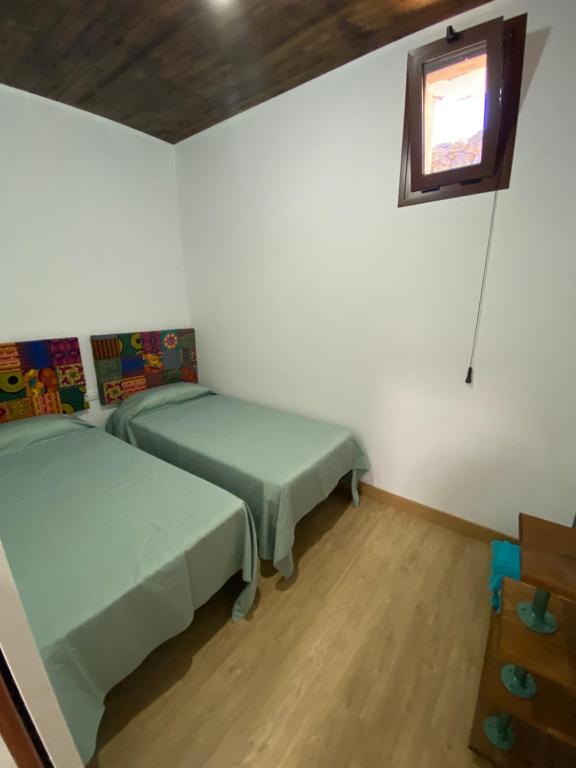 Posteľ alebo postele v izbe v ubytovaní Vivienda Vacacional Casa Lola