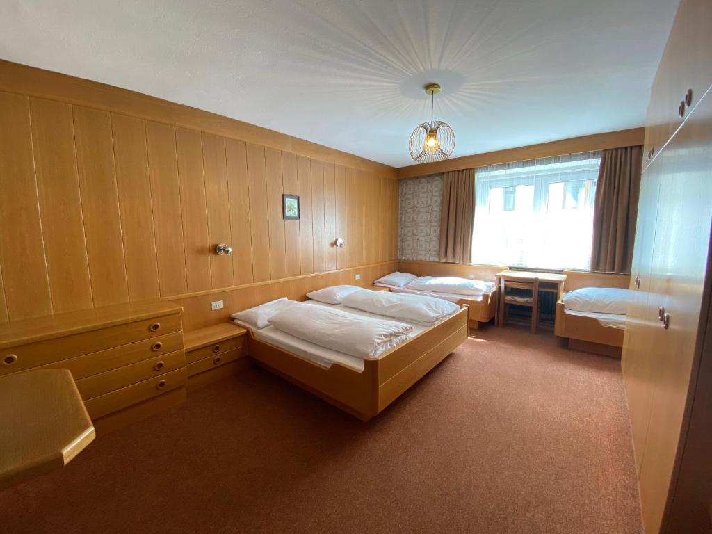 Posteľ alebo postele v izbe v ubytovaní Saskia Residence