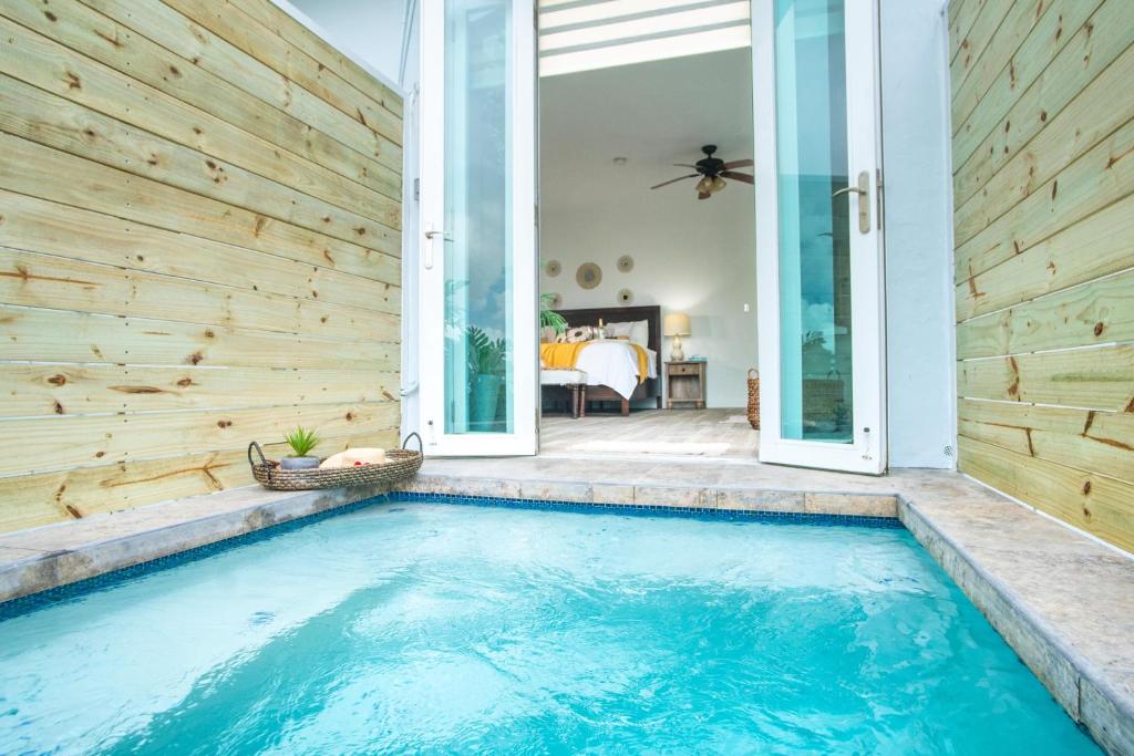 a swimming pool in the backyard of a house at Casa Loba Suite 3 with private pool and tub in Rincon