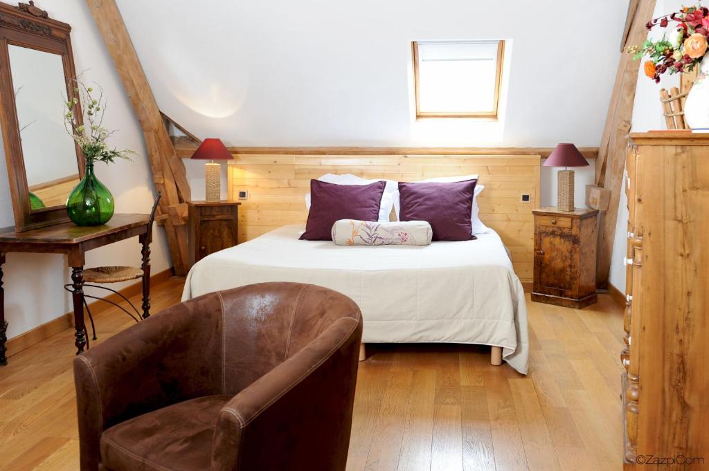 Postel nebo postele na pokoji v ubytování Hôtel La Grange Aux Marmottes