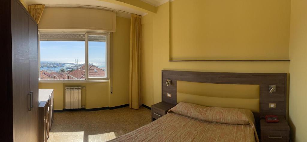 Postel nebo postele na pokoji v ubytování Hotel Robinia
