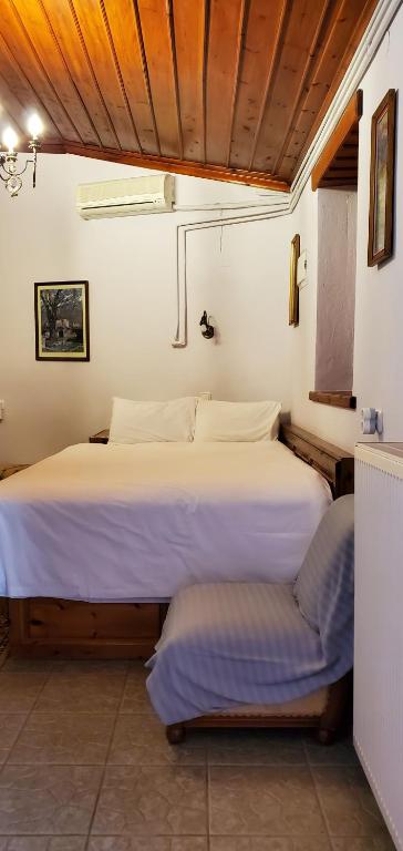 Postel nebo postele na pokoji v ubytování Papigo Astraka II