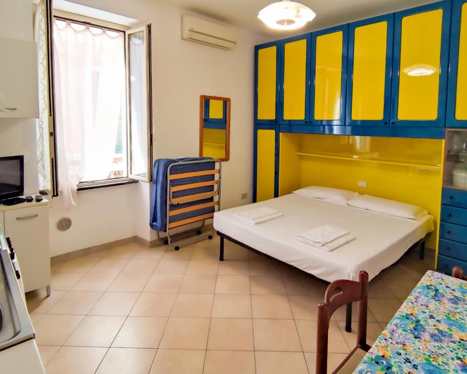 a room with two beds and a bunk bed at La cortese - By Ligooria in Pietra Ligure
