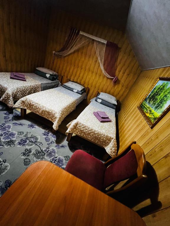 Postel nebo postele na pokoji v ubytování Pid Yavorom