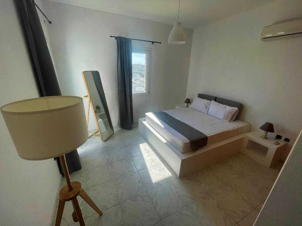 Postel nebo postele na pokoji v ubytování Revel Mykonos 4