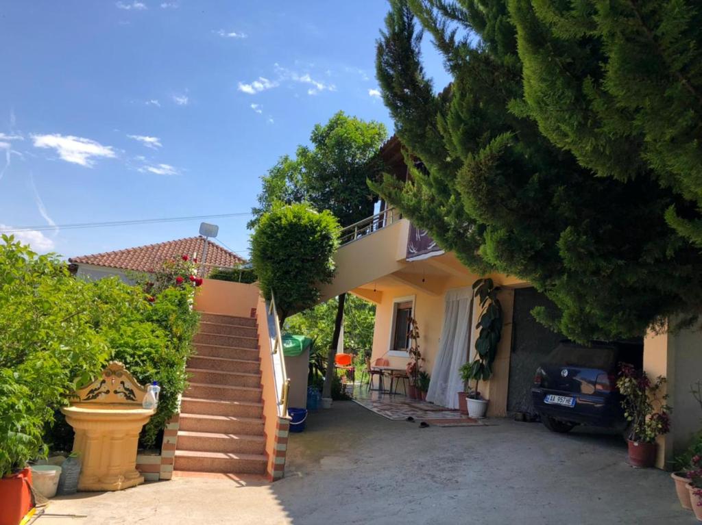 a house with a staircase in front of it at Villa Mukaj in Fratar