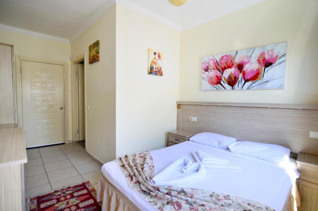 Postel nebo postele na pokoji v ubytování Sevin Hotel Pension