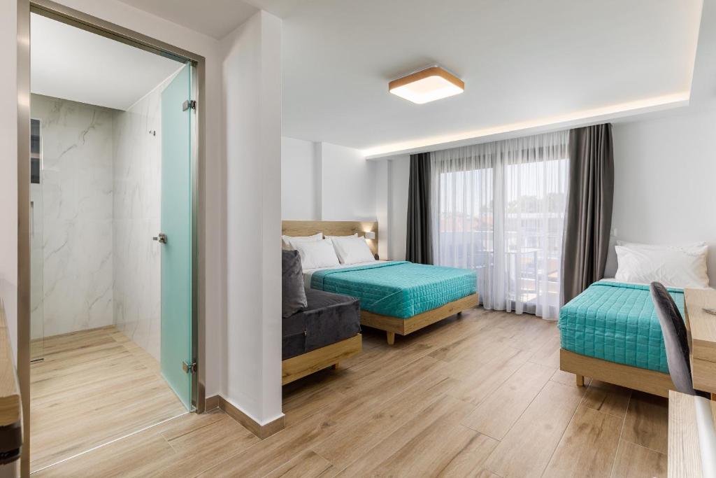 Postel nebo postele na pokoji v ubytování Anassa Suites