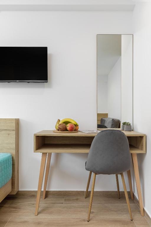 TV a/nebo společenská místnost v ubytování Anassa Suites