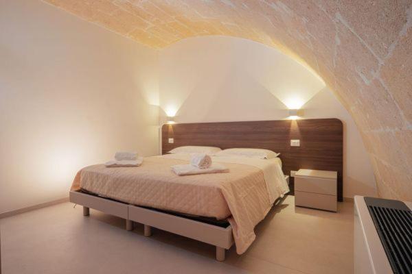 Postel nebo postele na pokoji v ubytování I Lamioni - Suite & accommodation