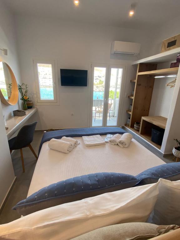 Postel nebo postele na pokoji v ubytování Xenios Zeus Apartments