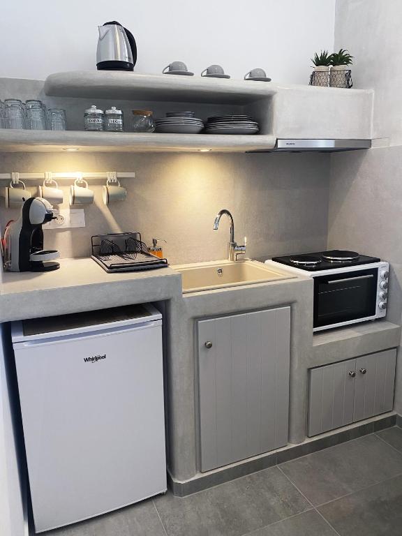 Kuchyň nebo kuchyňský kout v ubytování Xenios Zeus Apartments