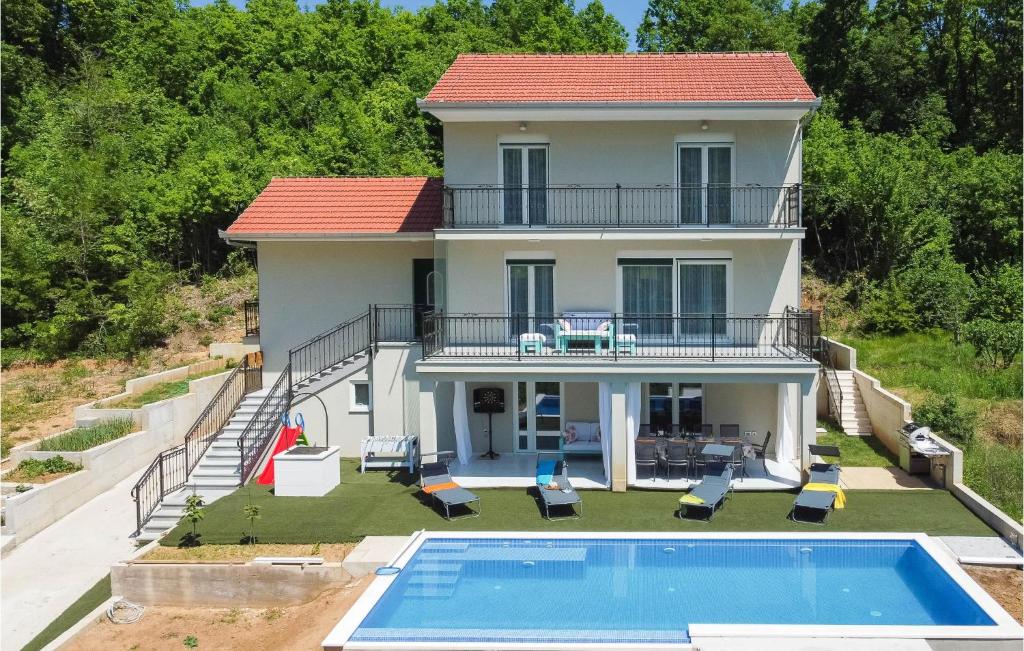 an aerial view of a house with a swimming pool at Stunning Home In Sinj With Wifi in Sinj