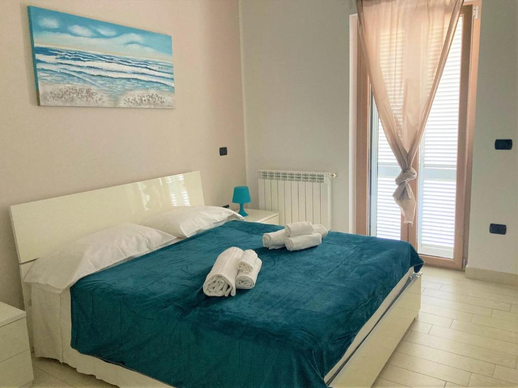 Posteľ alebo postele v izbe v ubytovaní La Casa del Mare