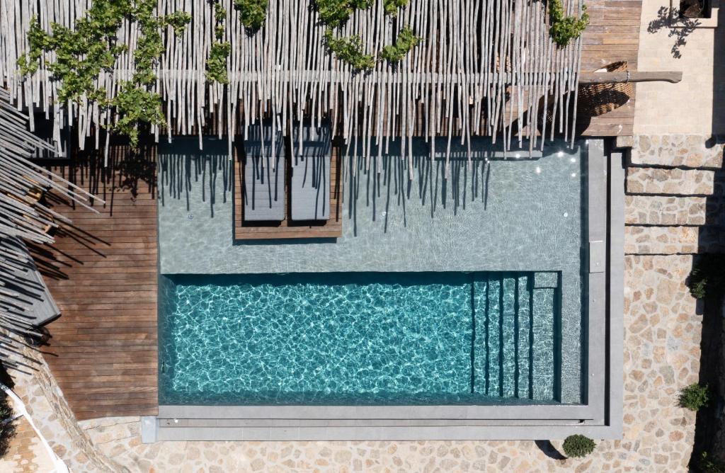 an overhead view of a swimming pool with icicles at Ikies of Mykonos in Mikonos