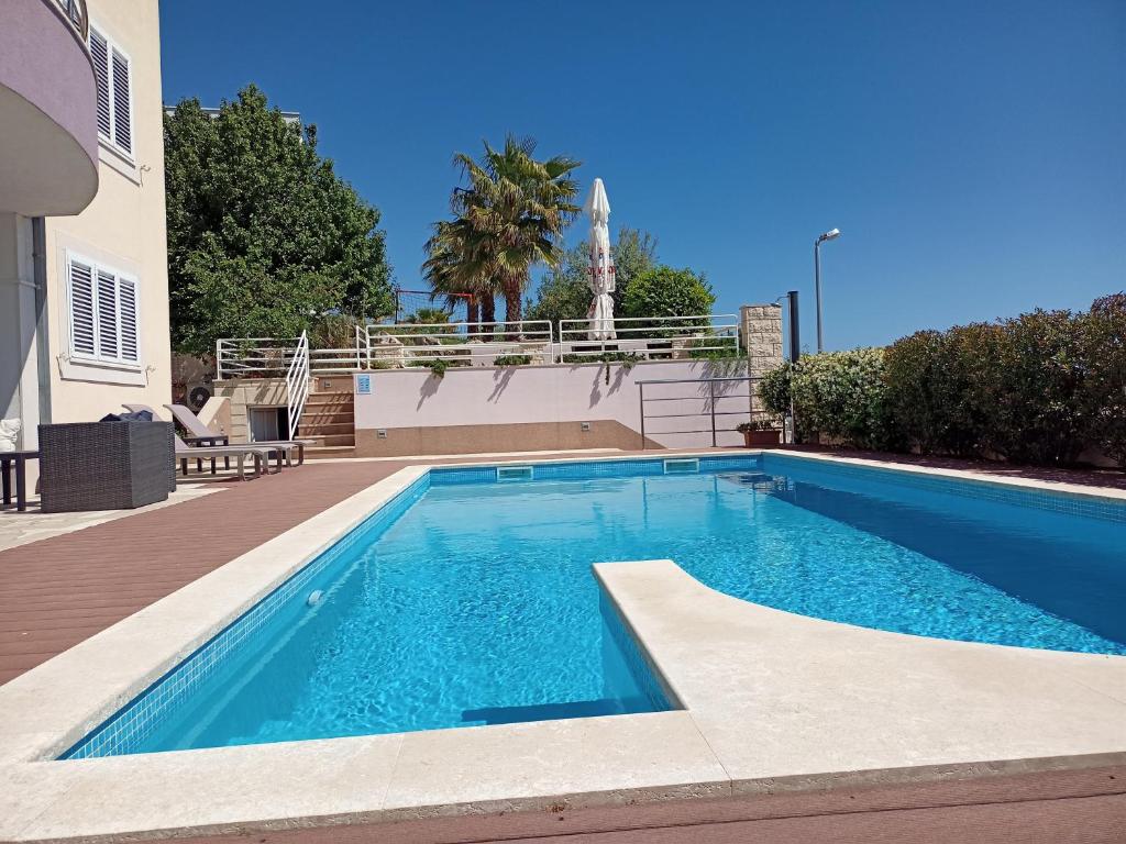a swimming pool in the middle of a house at SKY - beautiful rooftop apartment with shared pool in Split