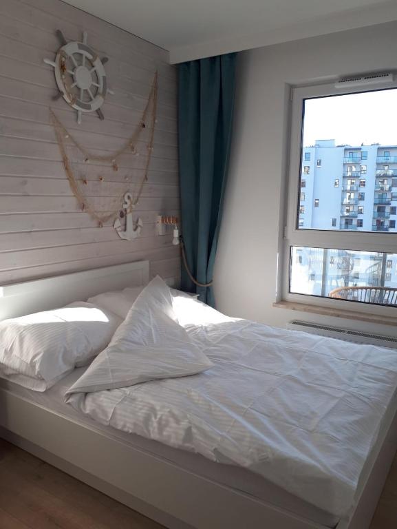 Posteľ alebo postele v izbe v ubytovaní Przytulny Apartament nad morzem
