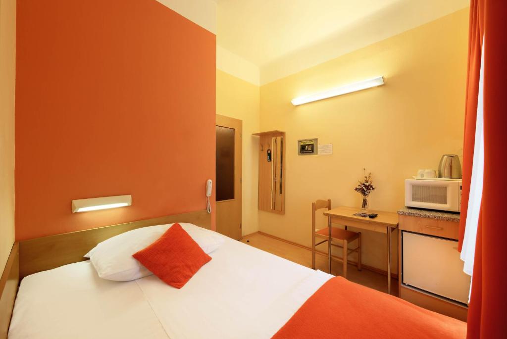 Postel nebo postele na pokoji v ubytování Residence Tabor