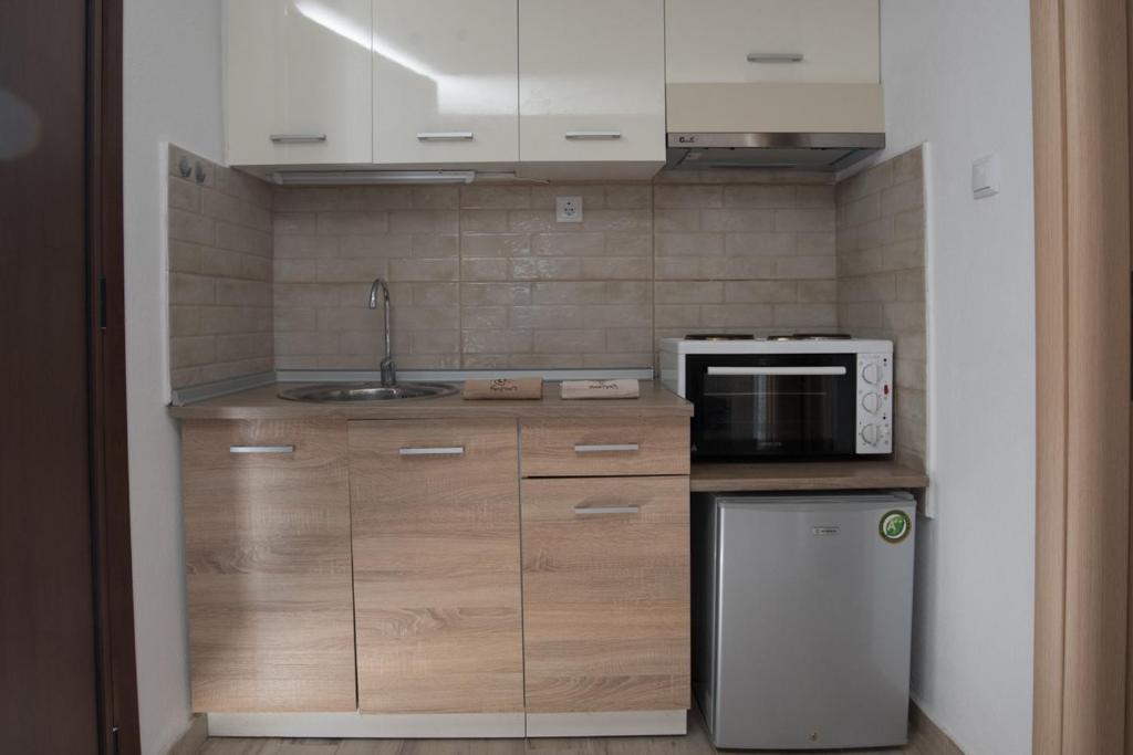 Kuchyň nebo kuchyňský kout v ubytování Olympia Studio By Rentals Pro - Agios Nikolaos Halkidiki