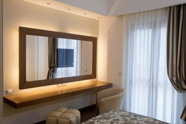 Postel nebo postele na pokoji v ubytování OC Hotel