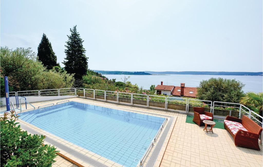 a swimming pool with a view of the water at 2 Bedroom Amazing Apartment In Portoroz in Portorož