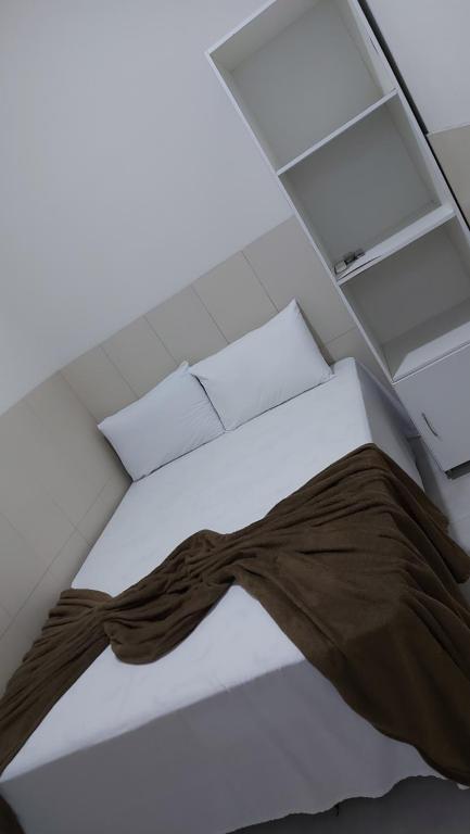Postel nebo postele na pokoji v ubytování Mini suíte Atitude no centro de Maragogi