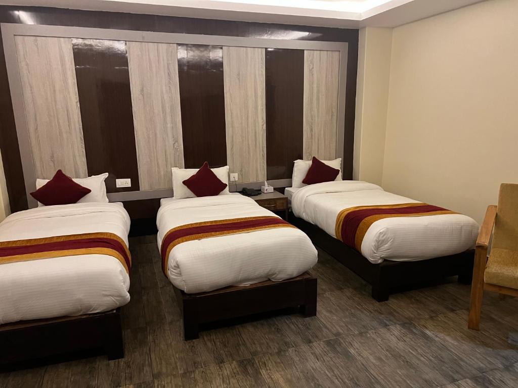 En eller flere senger på et rom på Hotel Murano