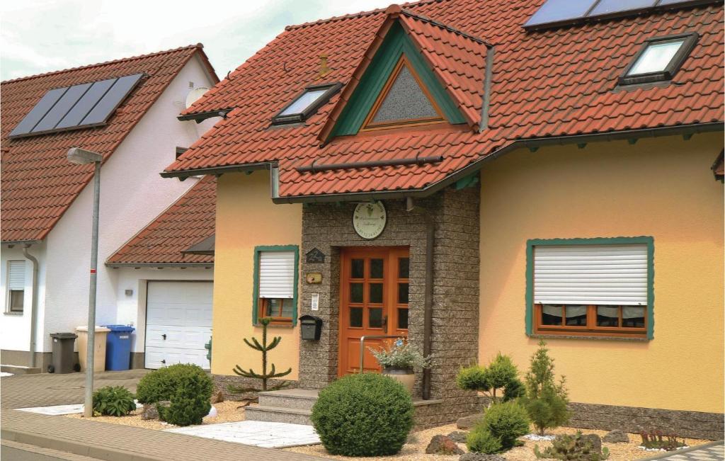 a house with a red roof at Cozy Apartment In Schlotheim With Kitchen in Schlotheim