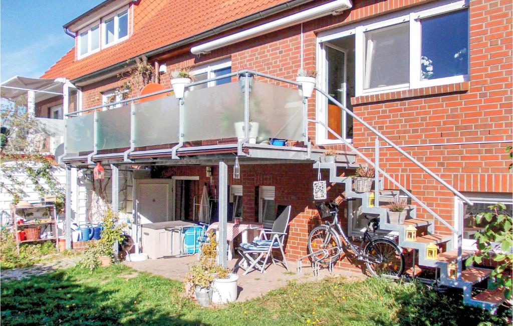 a house with a bike parked in front of it at Beautiful Apartment In Kühlungsborn in Kühlungsborn