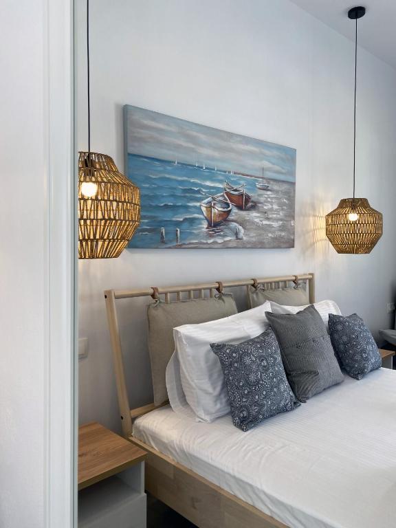 Postel nebo postele na pokoji v ubytování Xenios Zeus Apartments