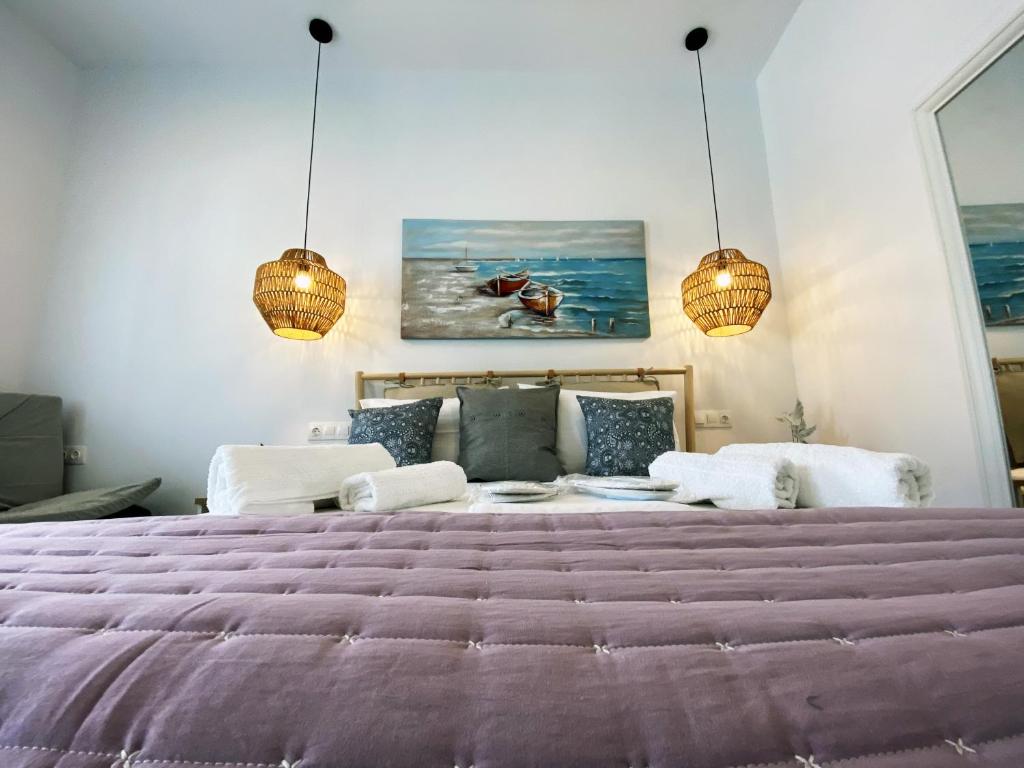Postel nebo postele na pokoji v ubytování Xenios Zeus Apartments