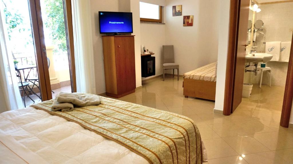 Postel nebo postele na pokoji v ubytování Hotel Residence Piccolo