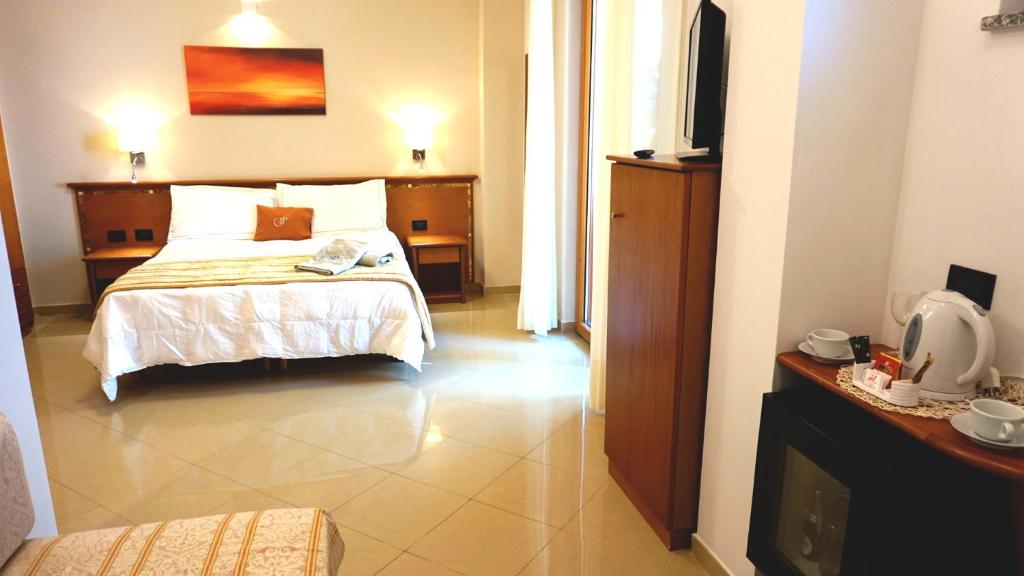 Postel nebo postele na pokoji v ubytování Hotel Residence Piccolo