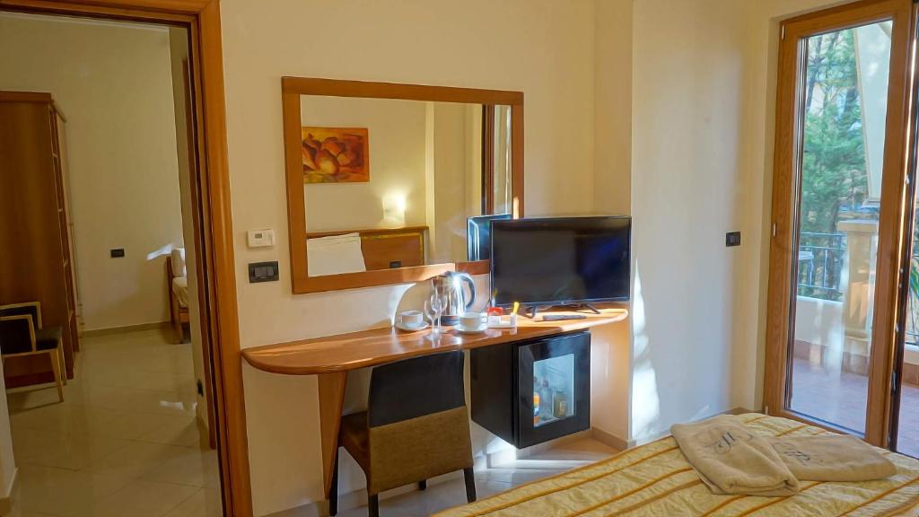 Postel nebo postele na pokoji v ubytování Hotel Residence Piccolo