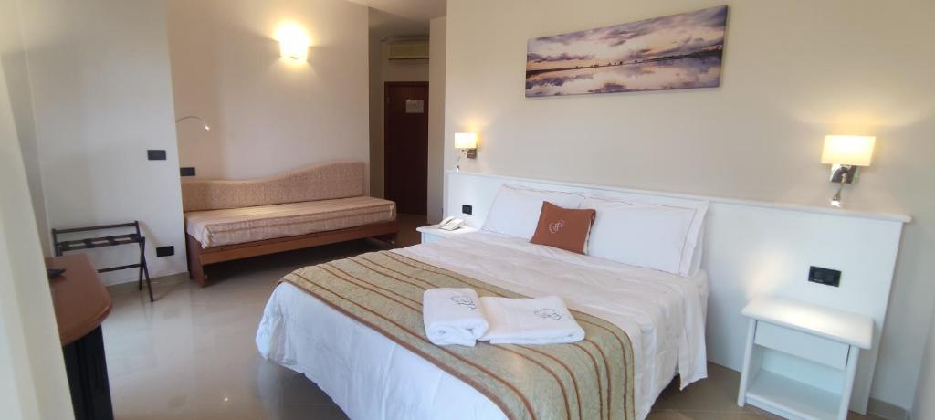 Postel nebo postele na pokoji v ubytování Hotel Residence Piccolo