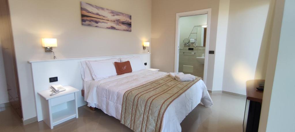 Postel nebo postele na pokoji v ubytování Hotel Residence Piccolo