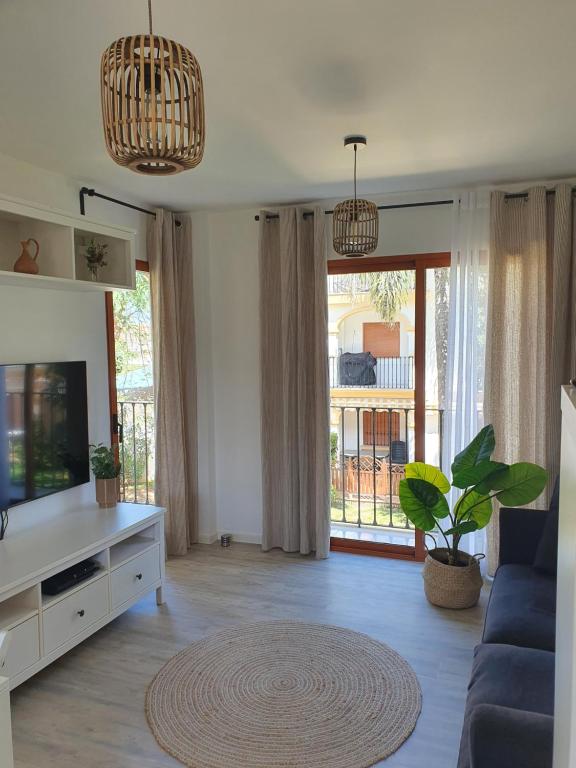 TV a/nebo společenská místnost v ubytování Lovely Apartment in Denia; El Patio