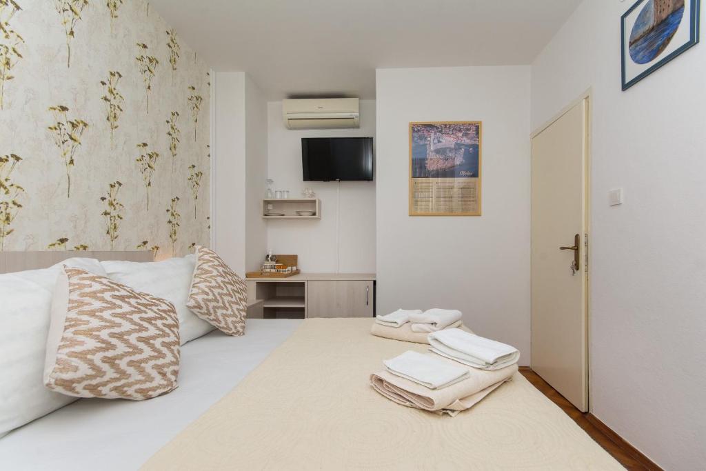 מיטה או מיטות בחדר ב-Villa Gloria