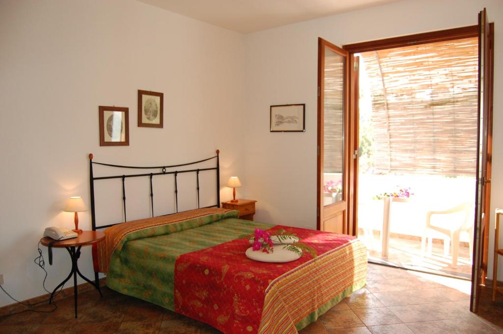 Postel nebo postele na pokoji v ubytování Residence Hotel Baia Portinenti