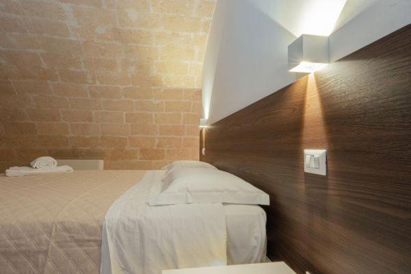 Postel nebo postele na pokoji v ubytování I Lamioni - Suite & accommodation