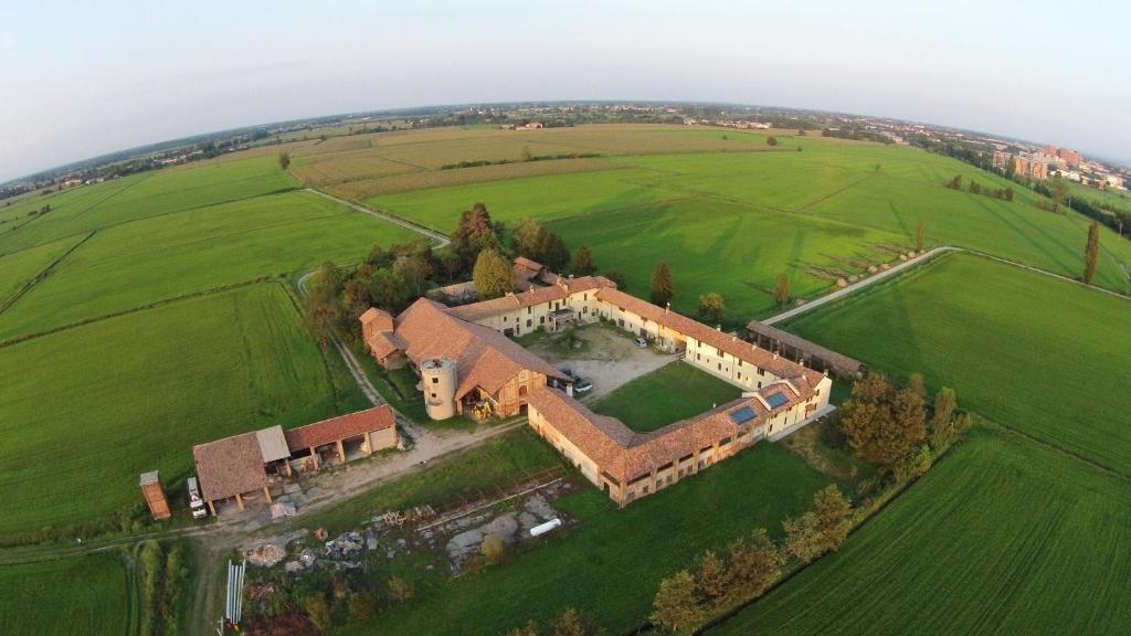 an aerial view of a large house in a field at Agriturismo Cascina Mora in Pavia