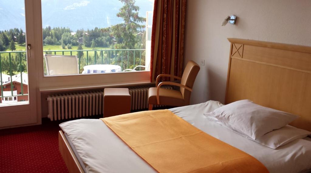 Postel nebo postele na pokoji v ubytování Hôtel Splendide