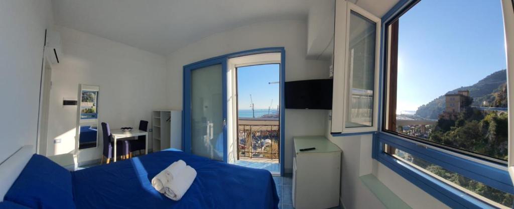Televízia a/alebo spoločenská miestnosť v ubytovaní B&B Acquamarine